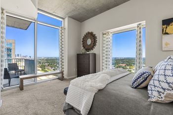 Allure Hermann Park | Spacious Bedroom with City Views